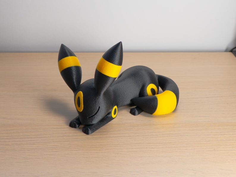 Black and yellow sleepy Umbreon collectible figurine
