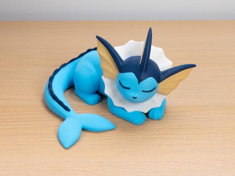 Blue sleepy Vaporeon collectible figurine